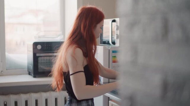 Sunlit kitchen portrait caucasian woman leaning over sink, long red hair near toaster oven, soft natural light, contemplative expression, private morning ritual hinting foresight and quiet fortune,