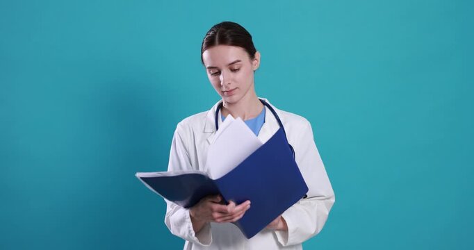 Medical assistant with folder on light blue background