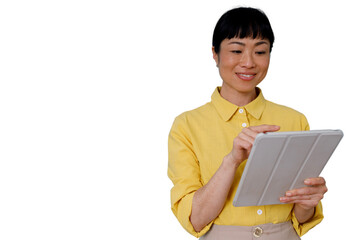 Obraz premium Asian woman using digital tablet, smiling, connecting, enjoying portable technology and communication on transparent background
