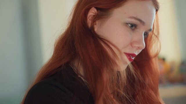 Closeup caucasian redhead tarot reader, contemplative expressions shift to warm smile while shuffling cards in sunlit studio, freckles catching light, delicate earrings, intimate consultation vibe,