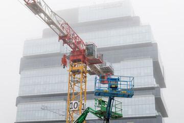 Naklejka premium crane at construction site of Ontario Line, Distillery District station formerly Corktown station, King Street East, Front Street East, Parliament Street, and Berkeley Street, Toronto