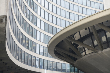 Naklejka premium Toronto City Hall (100 Queen St W), designed by architect Viljo Revell in the Modernist style, features twin curved concrete towers cradling a central, saucer-shaped council chamber