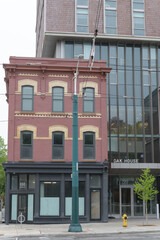 Naklejka premium exterior of Oak House, a student dormitory, located at 700 Spadina Av, Toronto - includes historic John James Funston’s Grocery (1885), 698 Spadina Av