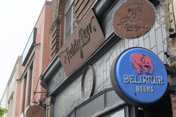 Naklejka premium exterior building facade and signage outside Teddy Beer, a bar, located at 928 Bloor St W, Toronto