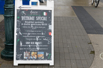 Naklejka premium a-frame sidewalk chalkboard sign at Buco Café Mercato, 615A Brock Av, north of Bloor St W, Toronto