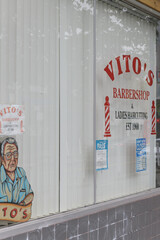 Naklejka premium display window with signs at Vito Barber Shop located at 1258 Bloor St W, Toronto