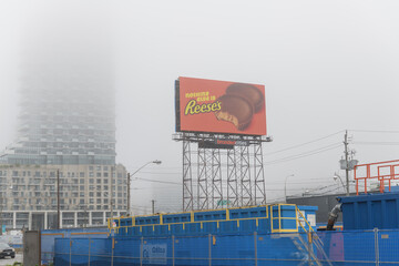 Naklejka premium construction site at Queens Quay E and Small St including a Scaffold Spectacular with advertising for Reese's, Toronto