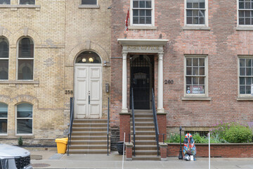Naklejka premium historic building (258 Adelaide E) and Toronto's First Post Office, a local history museum, located at 260 Adelaide St E