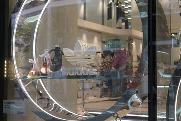Naklejka premium Adidas logo inside window display at Browns, a shoe store, located at 60 Bloor St W, Toronto