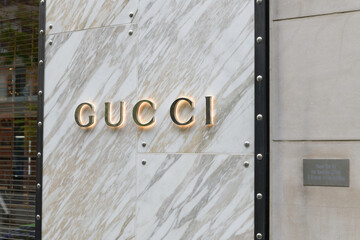 Naklejka premium sign outside Gucci, a luxury brand boutique, located at 130 Bloor St W, Toronto
