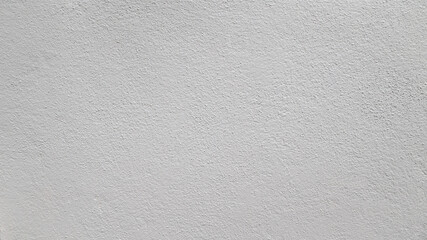 Abstract beige stucco wall texture background with a subtle rough finish and copy space. © Saminda