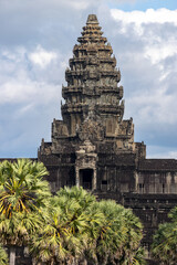 Fototapeta premium Angkor Wat temple complex in Siem Reap, Cambodia, is a breathtaking architectural marvel. This UNESCO World Heritage site showcases intricate carvings and ancient Khmer artistry.
