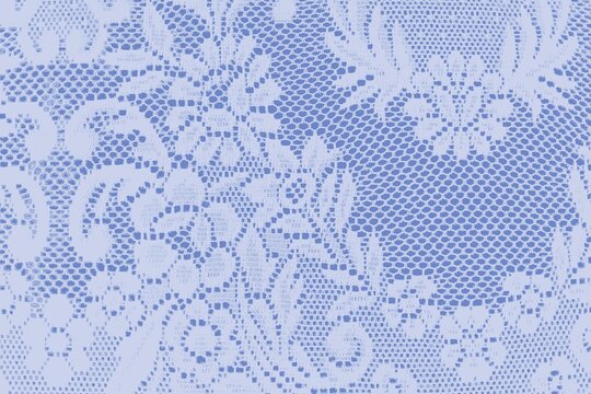 Intricate white lace pattern with floral and geometric designs.