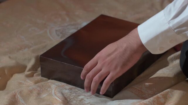 Person opening a secret gift box with empty inside, cinematic lifestyle concept.