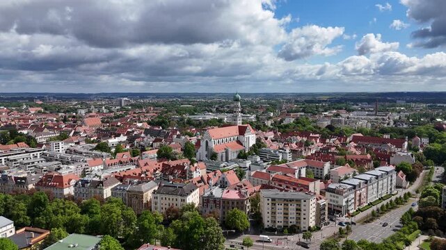 Drone view approaching a church while maintaining a circular path around the building.