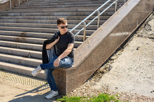 Young man in stylish clothes outdoors