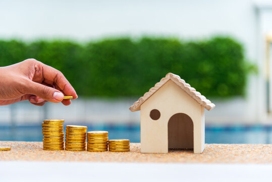 Hands Protect Debt loan home financial plan coin stack. Financial advice planning budget investment insurance concept. Money Investment advice plan budget banking insurance sustainable green