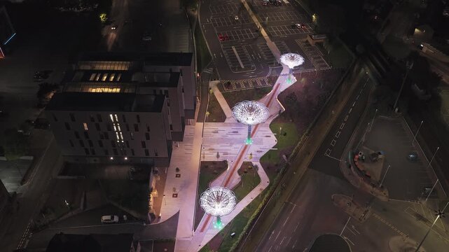 Illuminated rose canopy installation beside the Digital Media Centre at County Way, Barnsley town centre, South Yorkshire, England, showing regenerated public plaza and contemporary urban design