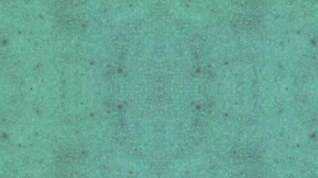 Textured teal surface with symmetrical geometric dots a grainy background
