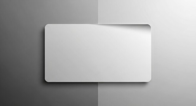White sticky note on gray background with shadow paper
