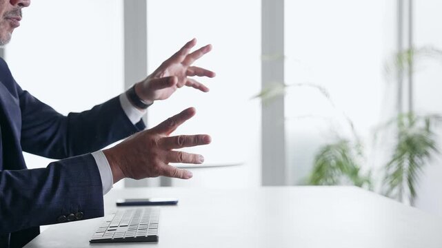 A male businessperson operating a screen in mid-air.