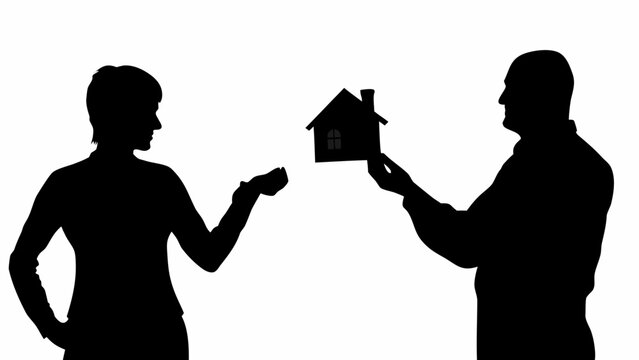 Silhouette of a man handing a small house model to a woman