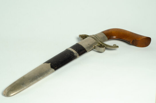 Traditional Bugis Gecong dagger featuring a wooden handle and sheath, representing the heritage and craftsmanship of South Sulawesi, Indonesia.
