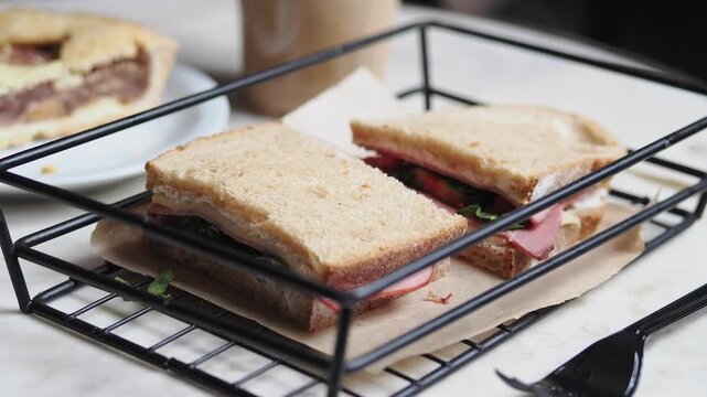 Enjoying a sandwich at a cafe during lunch time