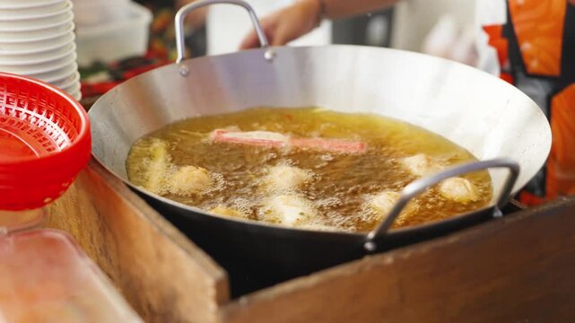 Street Vendor Cooking Filipino Snack in Hot Oil Cebu Philippines