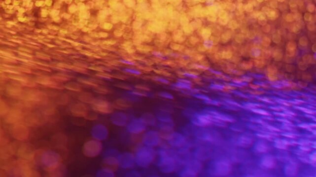 Shimmering mix. Blur confetti light. Orange violet strobe flare leak defocused beam spin reflection. Colorful abstract flicker bokeh background.