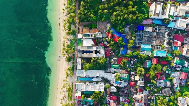 Top down drone shot reveals Bulabog Beach on Boracay east coast at sunrise