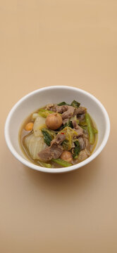 Thai Isan style herbal soup with chicken offal, egg ovaries and dill, traditional food.