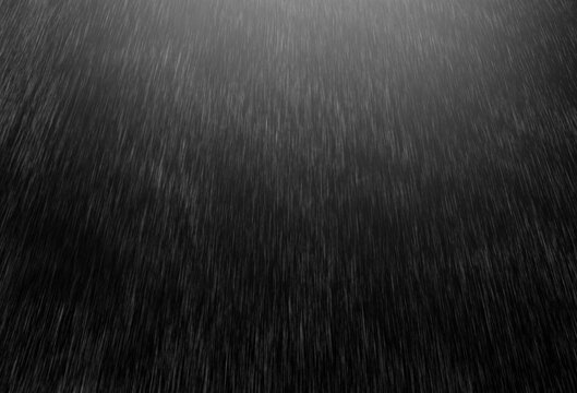Rain with sunlight on black isolated background. Rain texture for overlay