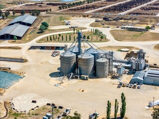 Aerial View 6 grain silos from high above at a cattle station © RLATHAMSPHOTOGRAPHY