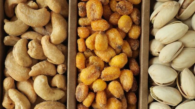 Assortment of roasted nuts and salted corn