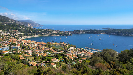 Naklejka premium Villefranche sur Mer bay and Marina on French Riviera, Provence-Alpes-Cote d'Azur, France, Europe. Villefranche sur Mer panorama presenting coastal town and a bay, Maritime Alps, France, Europe.