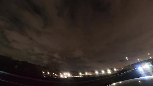 Night Drive on Highways. Car Mounted Camera Footage of Illuminated British Road Travel and Traffic During Night Drive on Motorways and Highways of England United Kingdom