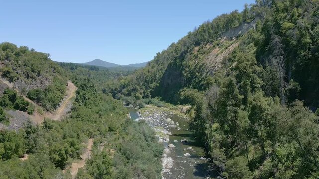 El Radal, Chile, ascending, aerial, view, drone, footage, river, mountain, rocky, canyon, cliffs, rugged, native, forest, dense, trees, landscape, Nuble, Andes, South America, nature, wilderness, remo