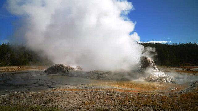 Castle Geyser Old Faithful Grand Geyser Midway Geyser Basin hot springs steam Fall Autumn morning blue sky sunny Yellowstone National Park Wyoming Gran Prismatic Spring geothermal environment nature