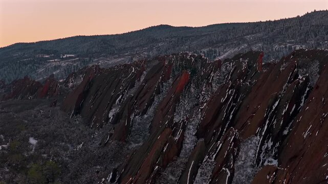 Springtime fresh snowfall Denver Front Range snow covere jagged sharp Red Rocks Peaks landmark Roxborough State Park Sterling Ranch Colorado aerial drone Fountain Valley South Rim Trail Overlook Vista