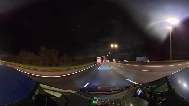 Night Drive on Highways. Car Mounted Camera Footage of Illuminated British Road Travel and Traffic During Night Drive on Motorways and Highways of England United Kingdom