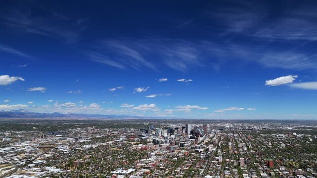 Vast big blue sky Downtown Denver landscape spring summer sunny morning Burnham Yard railyard Denver Broncos stadium aerial drone Colorado i25 cars traffic city buildings Front Range rockies circle