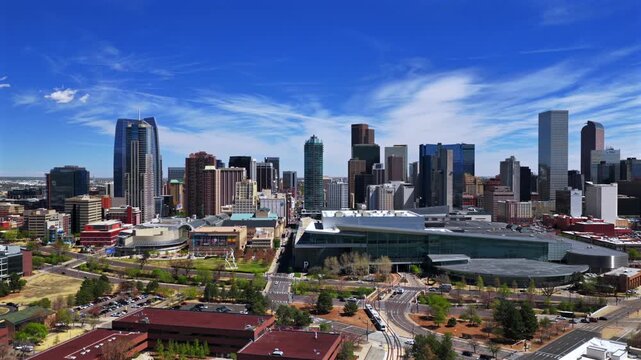 Downtown Lodo Denver Performing Arts Complex Auraria Campus sunny springtime summer morning blue sky Colorado Convention Center aerial drone skyscraper buildings car traffic streets forwards motion