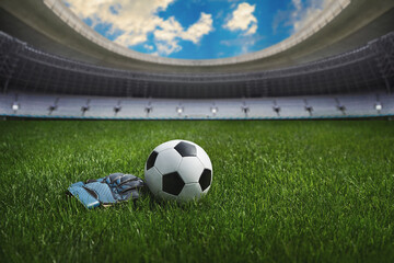 Obraz premium ball on the green field in soccer stadium. ready for game in the midfield