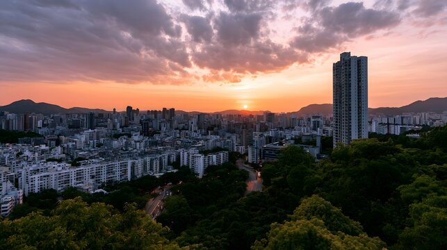 A dramatic cityscape is bathed in the warm glow of a vibrant sunset sky over a dense urban landscape