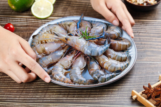 Fresh Raw Shrimp Selection on Plate with Lime and Spices Ready for Cooking
