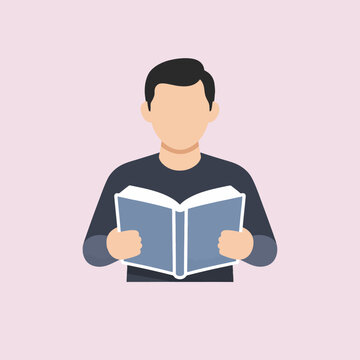 A person is holding and reading a book with a light pink background