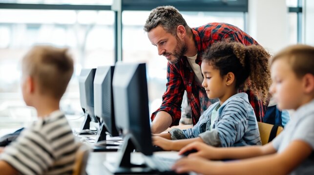 Teacher helping students in computer lab classroom