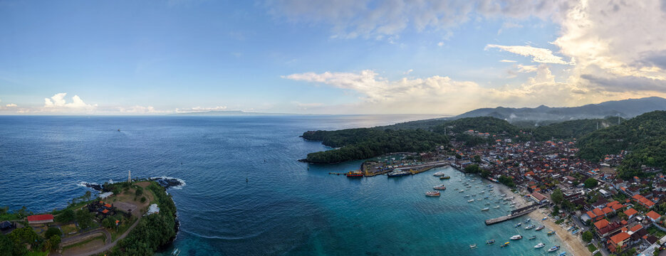 Wide Aerial Panorama of Padang Bai Harbor Coastal Town and Blue Ocean in Bali