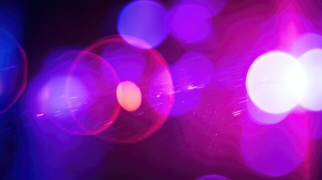Abstract bokeh lights in vibrant purple and pink hues creating a dreamy atmosphere.